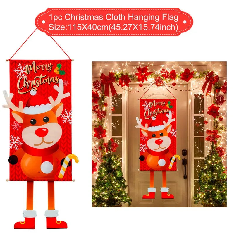 Christmas cloth hanging flag featuring a reindeer with a Santa hat, large eyes, and candy cane, captioned "Merry Christmas." Displayed on a festively decorated front door.