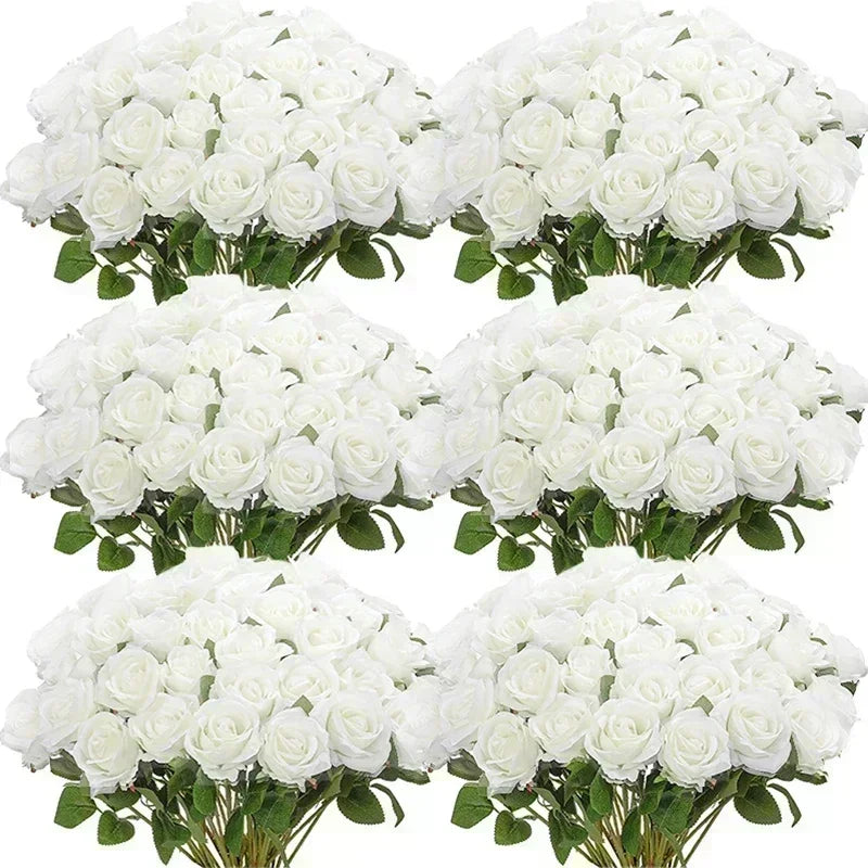 Bunches of white roses with green leaves, arranged in a pattern. The flowers are full and lush, highlighting their bright white petals against the deep green foliage.