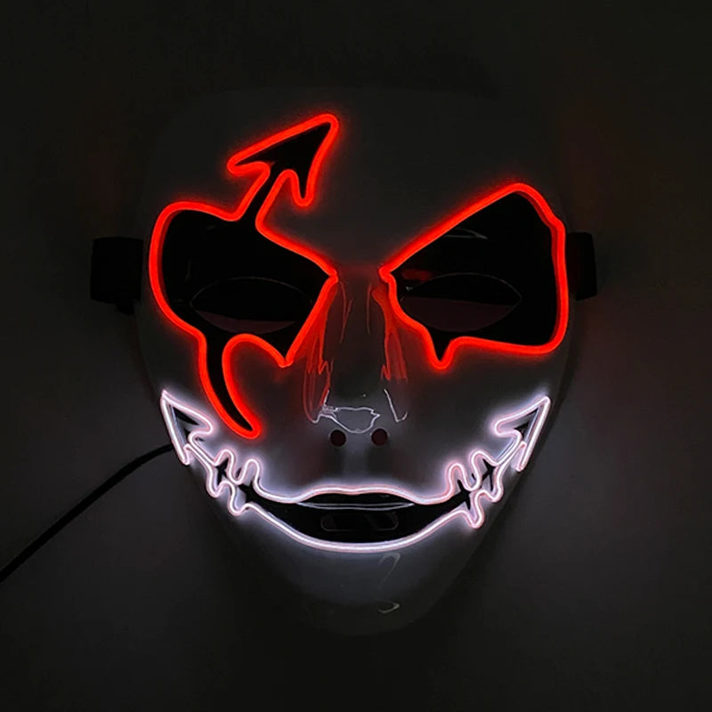 A white mask with red LED devil eyes and a red arrow, featuring a white jagged line for a mouth, glowing in the dark.