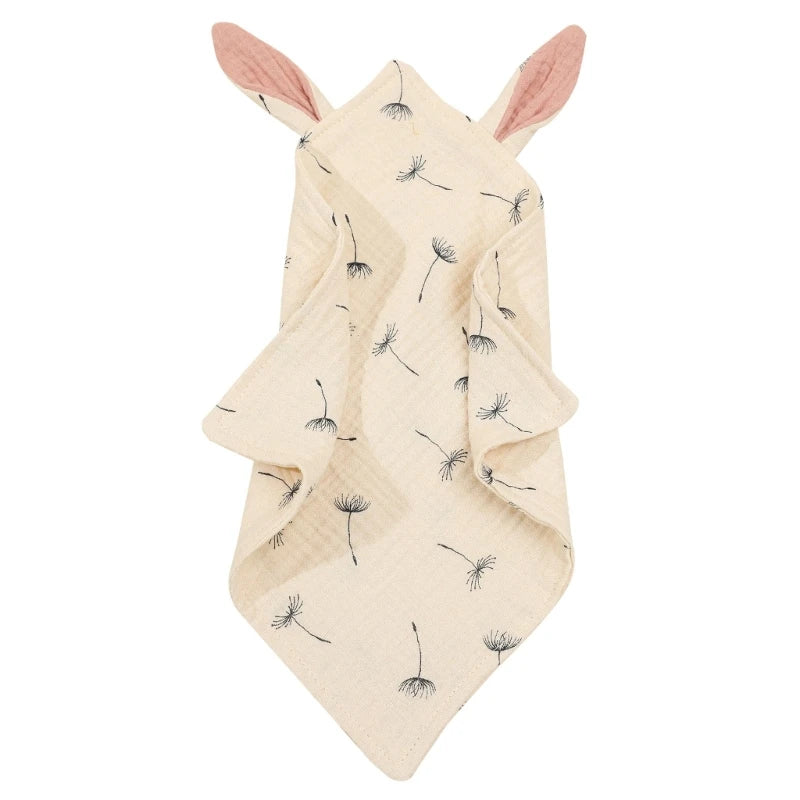 Cream-colored blanket with dandelion prints and attached pink ears at the top, arranged in a three-pointed draped style for an appealing display.