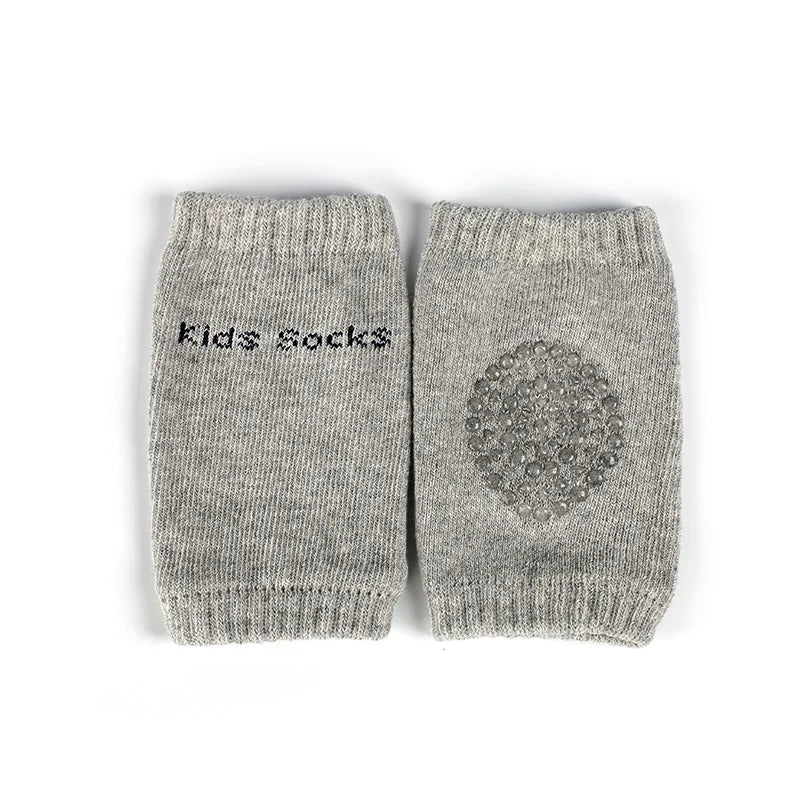 Gray ankle socks for kids, featuring "Kids socks" text on one and a textured circular grip pattern on the other.