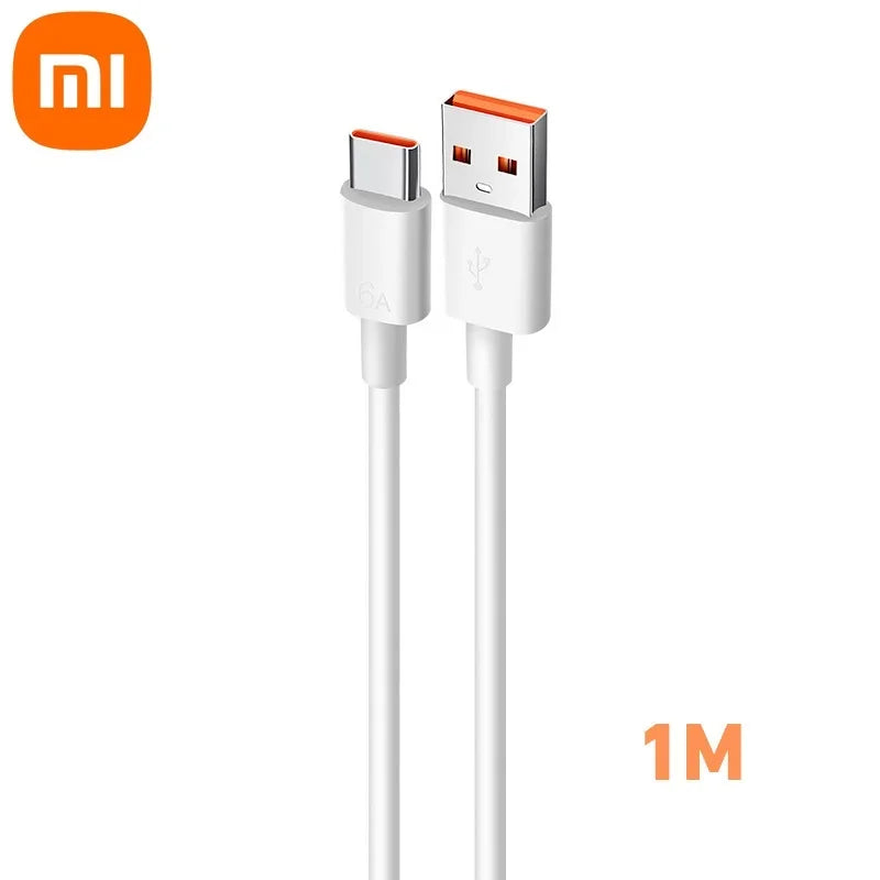 White USB-A to USB-C cable with orange accents and "Mi" logo, 1 meter long, designed for fast charging and data transfer.