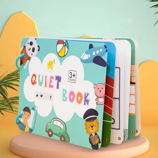 Children's Quiet Book for ages 3+, featuring colorful illustrations of a panda, airplane, car, and lion on the cover. Pages are ring-bound and numbered.