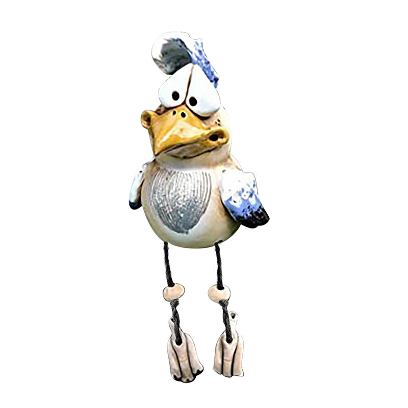 Whimsical ceramic duck figurine with a bewildered expression, long legs, and blue accents on its wings and hat, standing against a plain white background.