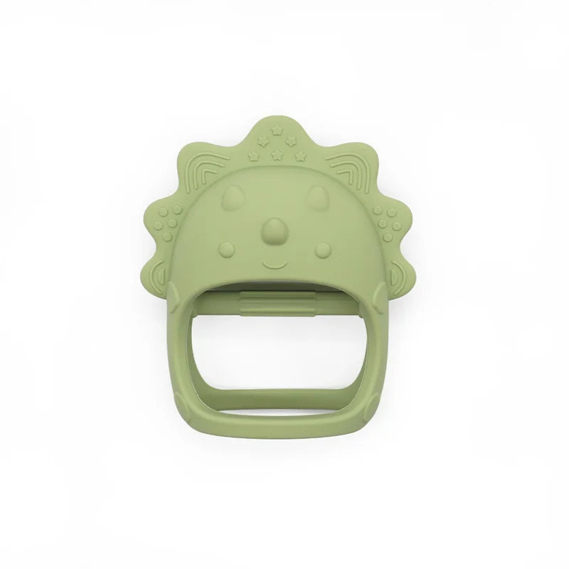 Green lion-shaped silicone teething toy with textured mane and smiling face on a white background.