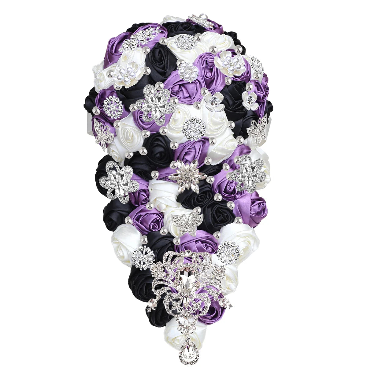 A teardrop-shaped bouquet with purple, white, and black silk roses, adorned with silver brooches and pearls, forming an elegant, intricate bridal arrangement.