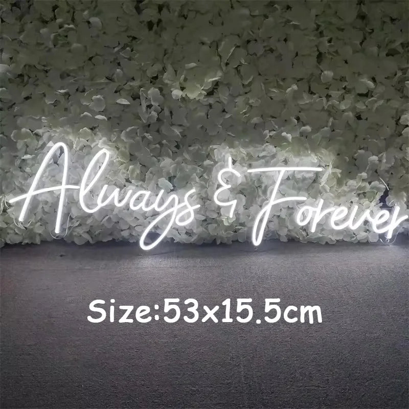 "Neon sign reading 'Always & Forever' against a floral backdrop. Text below indicates size: 53x15.5cm."