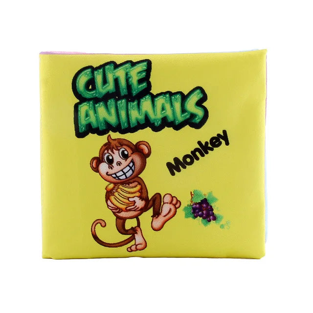 Yellow cover of a children's book titled "Cute Animals," featuring a smiling cartoon monkey holding a banana, with grapes nearby. Bold green and black lettering.