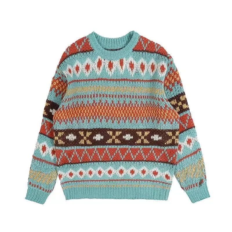 Multicolored knitted sweater with geometric patterns in red, teal, mustard, and brown. Features stripes, diamond shapes, and zigzags on a ribbed crewneck design.