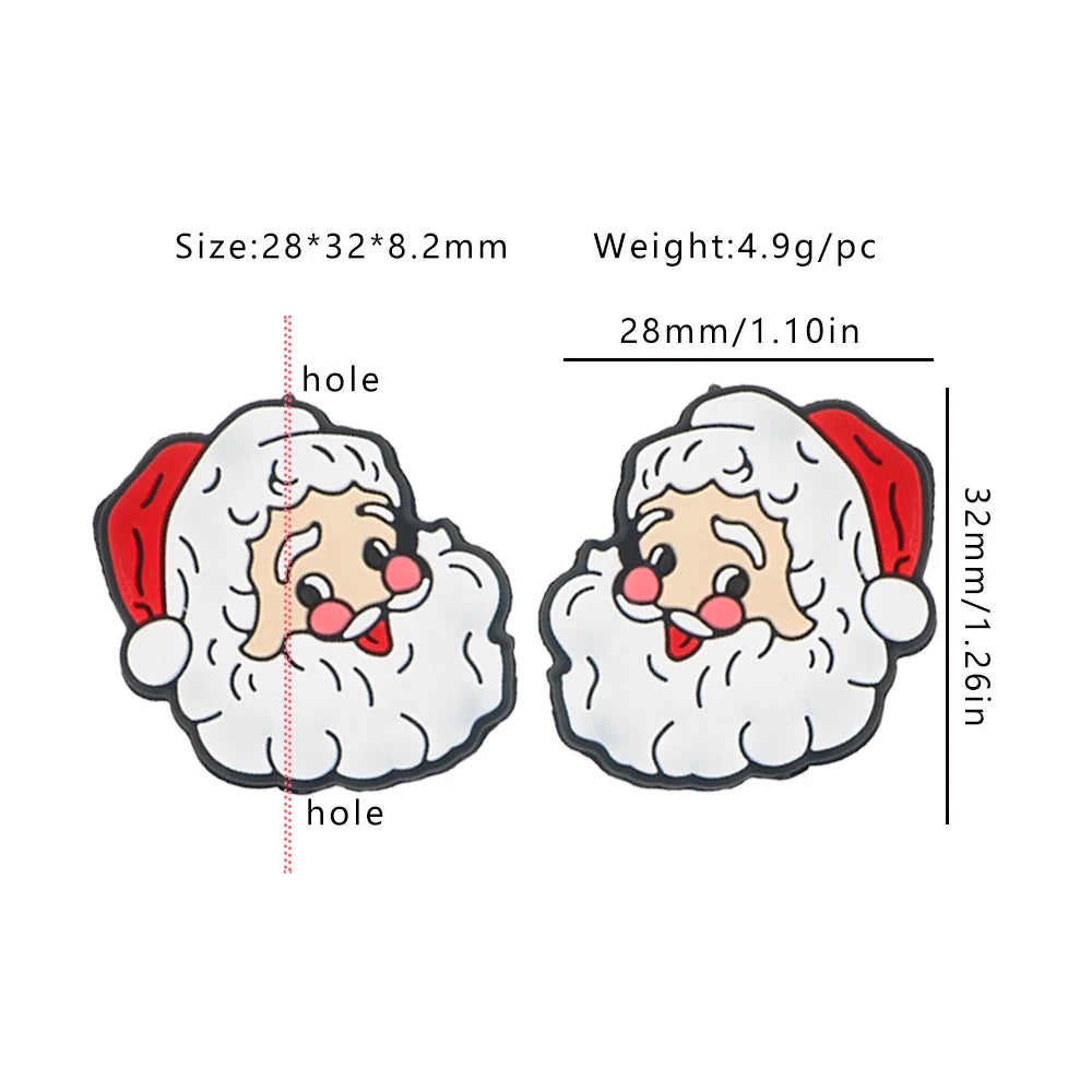 Two cartoon Santa faces with red hats, rosy cheeks, and white beards. Dimensions: 28x32x8.2mm, weight: 4.9g each. A hole is shown for attachment.