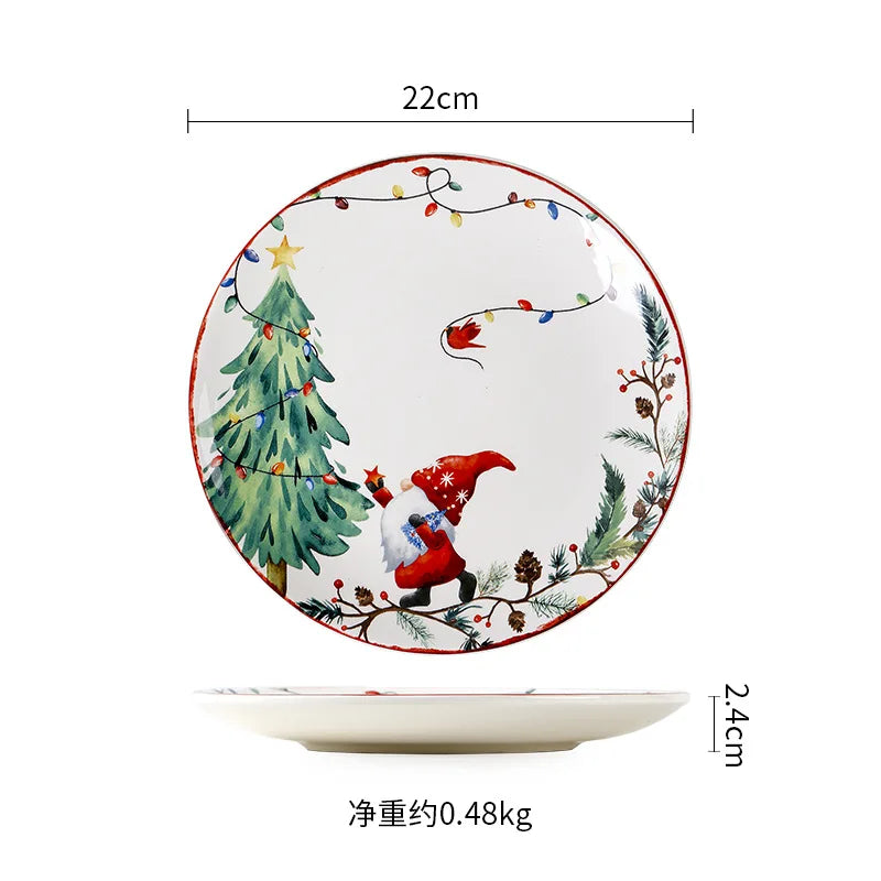 Decorative plate with Santa carrying gifts beside a Christmas tree adorned with lights. It features festive foliage and colorful bulbs. Dimensions: 22cm diameter, 2.4cm height. Weight: 0.48kg.
