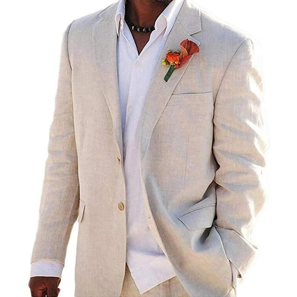 Man wearing a light beige suit with a white shirt and an orange boutonniere. One hand is in his pocket. The suit is suitable for a formal or semi-formal occasion.