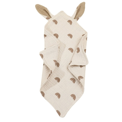 Beige baby towel featuring brown rainbow patterns and bear ears on the hood. Soft, textured fabric with a simple, playful design suitable for young children.