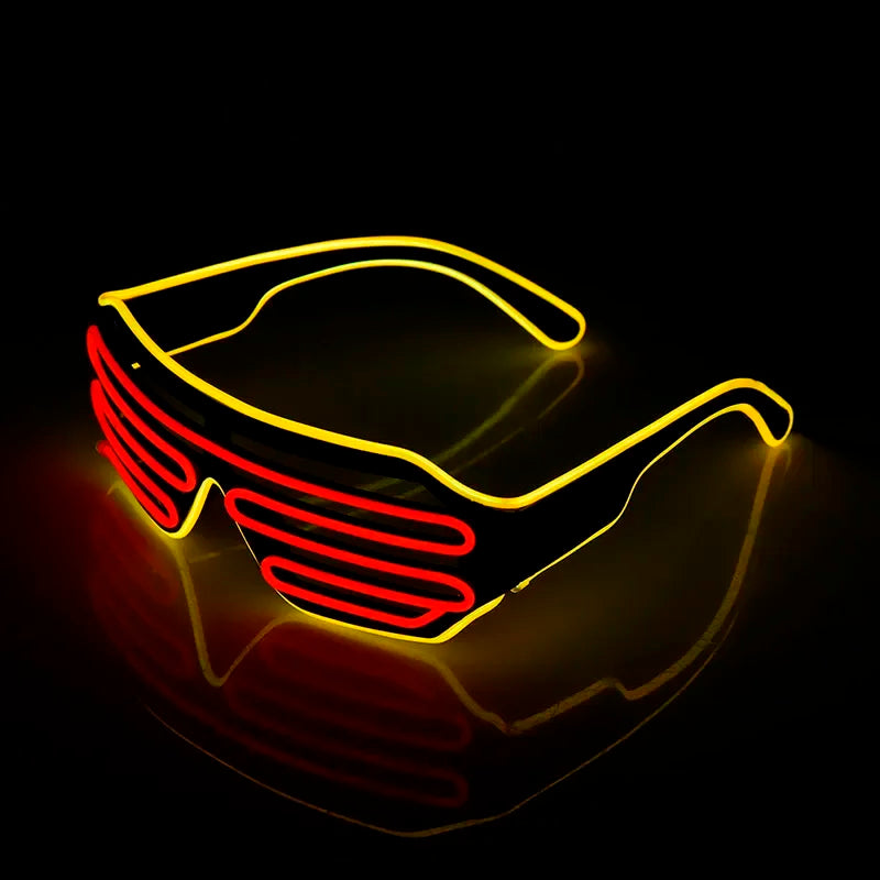 LED glasses with a futuristic design featuring bright yellow frames and red shutter-style lenses, glowing brightly against a dark background.