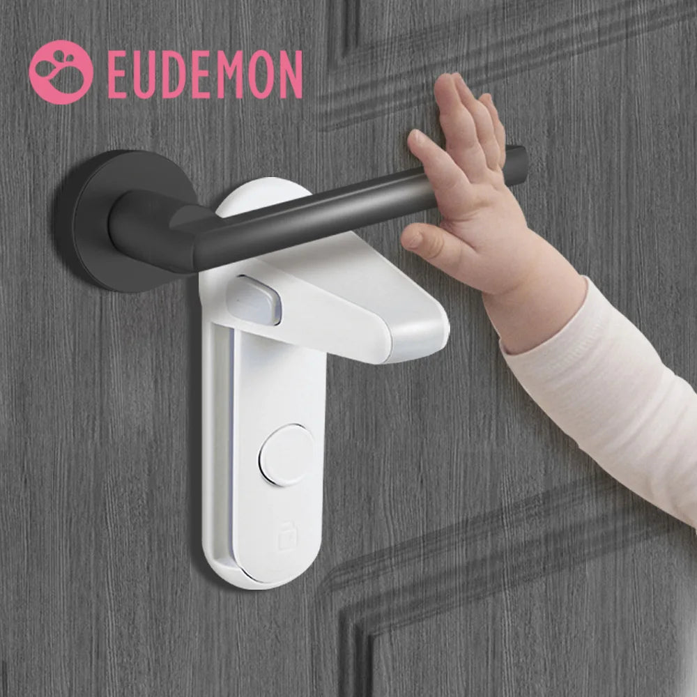 A baby's hand reaching for a black door handle secured with a white safety lock. The word "Eudemon" is visible in the top left corner.