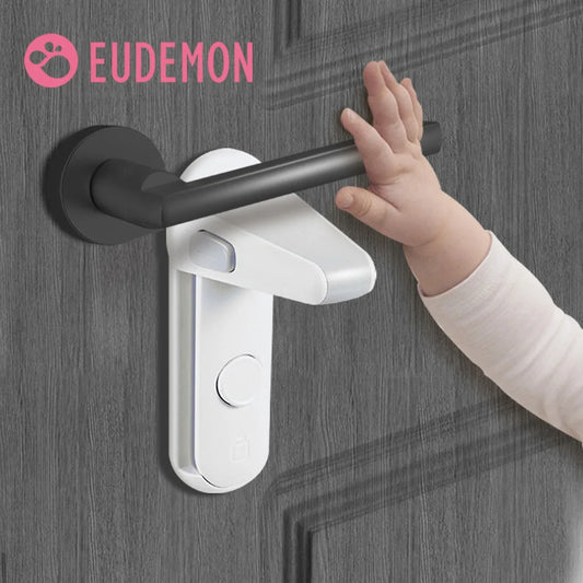 A baby's hand reaching for a black door handle secured with a white safety lock. The word "Eudemon" is visible in the top left corner.