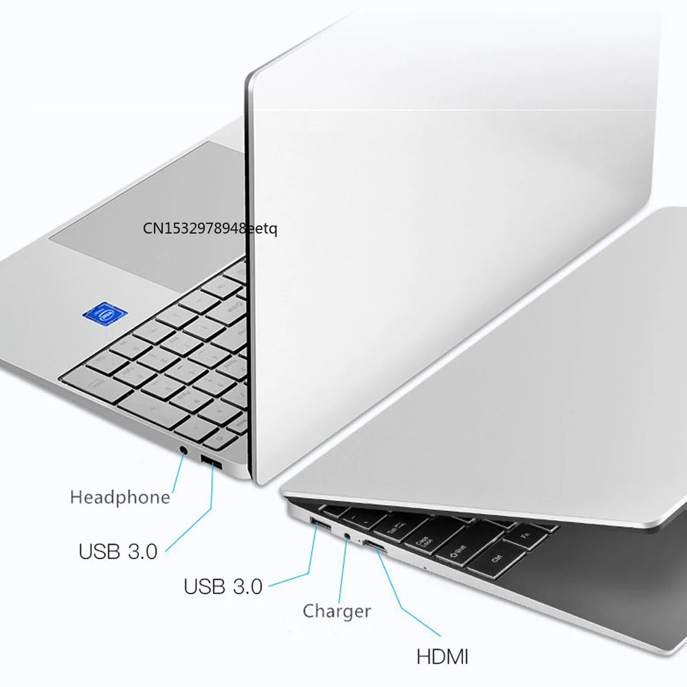 Silver laptop partially open, showing ports on the side: two USB 3.0, headphone jack, charger port, and HDMI. Keyboard visible with touchpad and blue highlighted key.