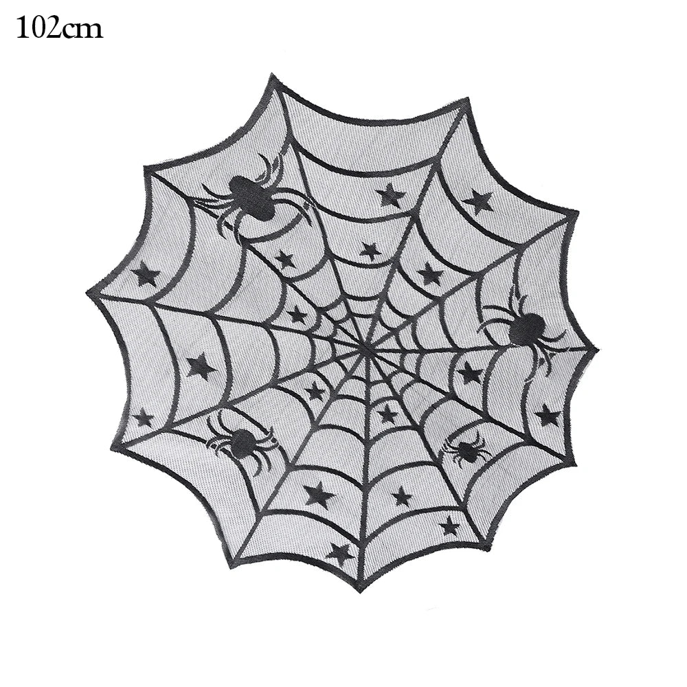 Black spider web tablecloth with spider and star patterns, measuring 102 cm in diameter. Ideal for Halloween or themed decor.