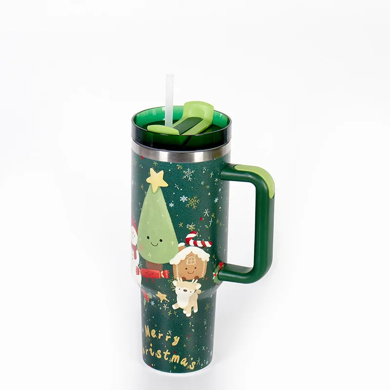 Tall green Christmas-themed travel mug with handle, featuring a festive design of a Christmas tree, snowflakes, and holiday characters. Equipped with a straw lid.