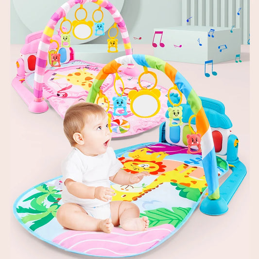 A baby sitting on a colorful play mat with animal illustrations and two play gyms, featuring hanging toys, mirrors, and musical notes in the background.