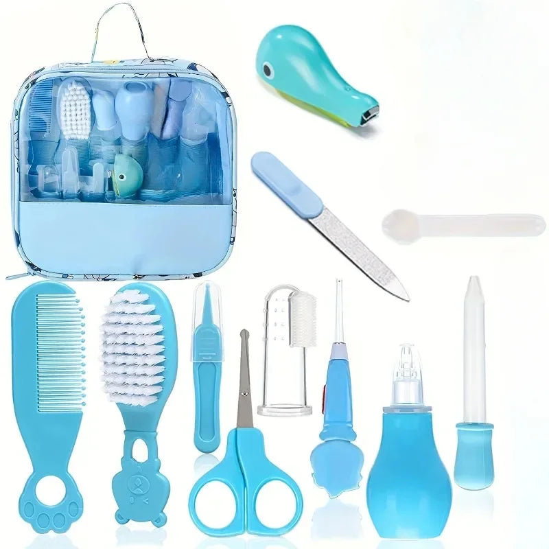 A baby grooming kit with blue items: toothbrush, clippers, nasal aspirator, brush, comb, scissors, nail file, and more. Items are displayed alongside a transparent travel case.