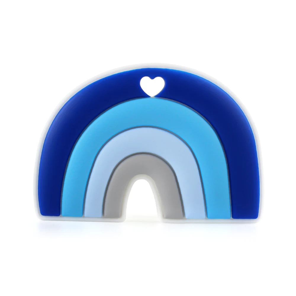 Blue gradient rainbow toy with five arched layers transitioning from dark to light blue, featuring a cutout heart at the top. The design has a minimalist and modern look.