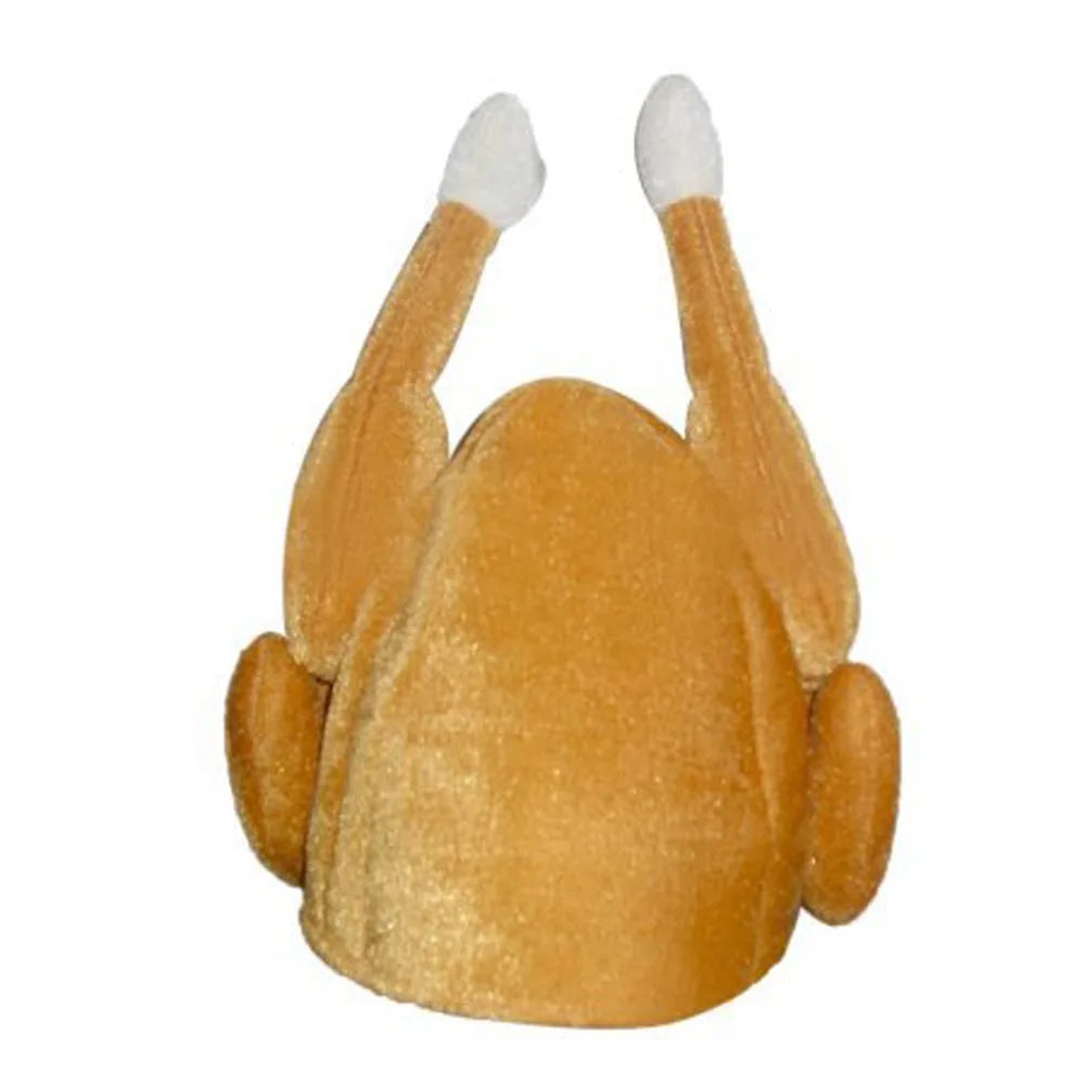 Plush hat shaped like a roasted turkey with drumsticks sticking up and white tips. The hat is a light brown color, mimicking the appearance of a cooked turkey.