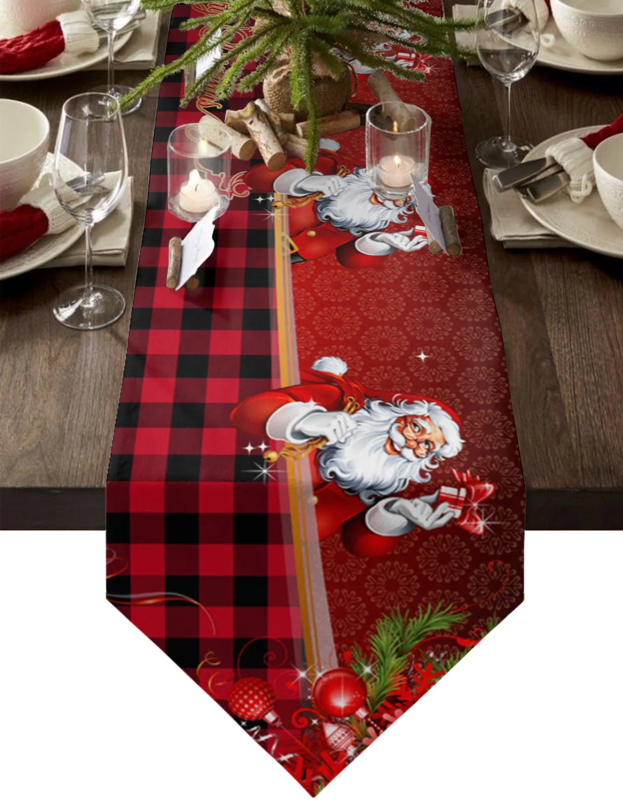 Festive table setting featuring a red and black plaid table runner with Santa Claus design, surrounded by white dishware, red napkins, candles, and a small plant centerpiece.
