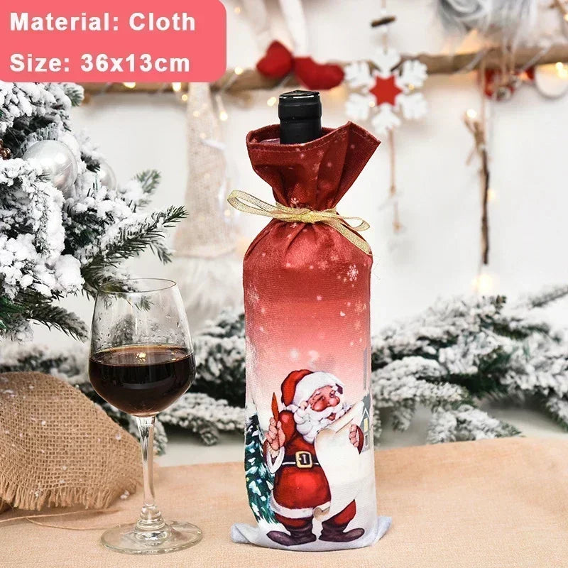 A wine bottle in a Santa-themed cloth cover beside a glass of red wine, set on a snowy Christmas table with decorations. Text in the image reads: "Material: Cloth, Size: 36x13cm".
