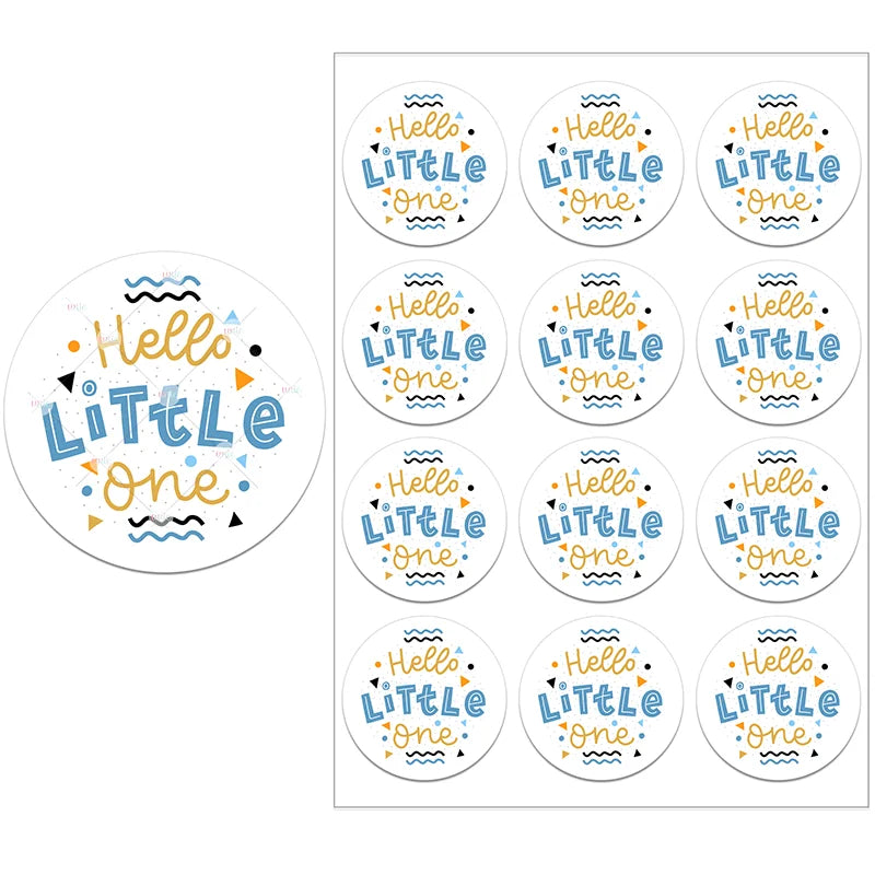 Sheet of round stickers with "Hello Little One" in blue and gold text, adorned with geometric shapes and wavy lines on a white background.