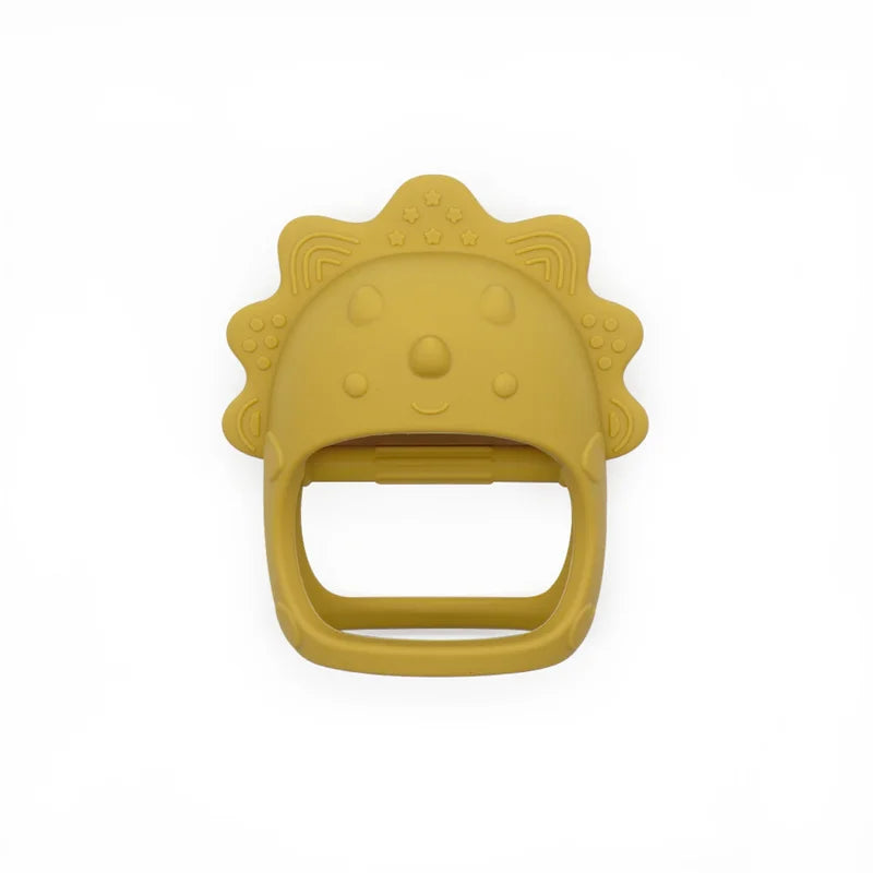 Yellow silicone baby teether shaped like a smiling lion with a mane decorated with stars and small patterns. It's designed for easy gripping, ideal for soothing teething babies.