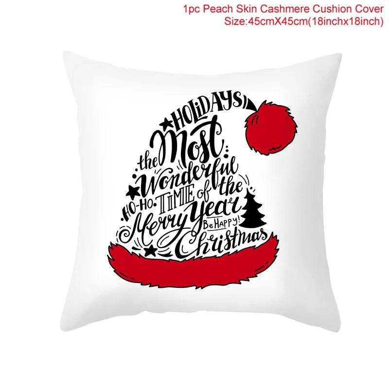White cushion cover with festive black text shaped like a Santa hat, saying “Holidays, the most wonderful time of the year. Merry Christmas.” Red pom-pom and trim accents.