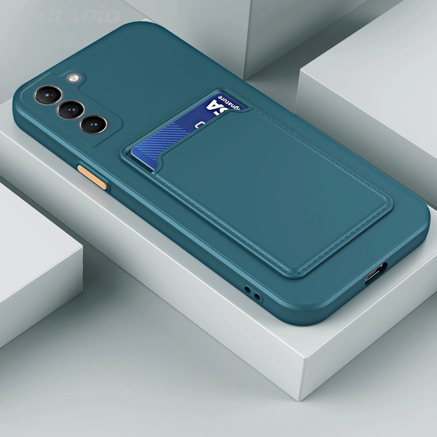 Teal phone case with card holder on the back, holding a blue bank card. The case has three camera cutouts and an orange button on the side, displayed on a white surface.