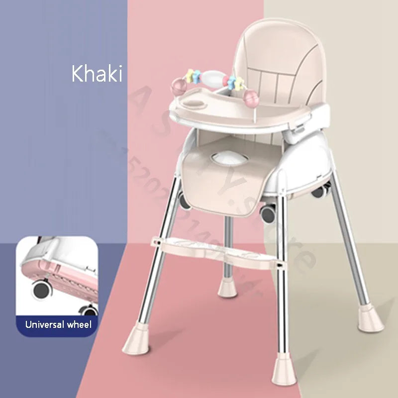 Khaki high chair with a tray and toys, featuring universal wheels for mobility. It has a sleek design with chrome legs, set against a pink and beige color block background.