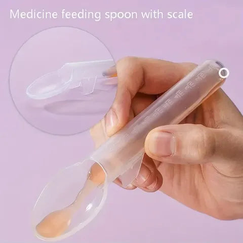 Hand holding a transparent medicine feeding spoon with measurement scale against a pink background. Inset shows a close-up of the spoon's tip.