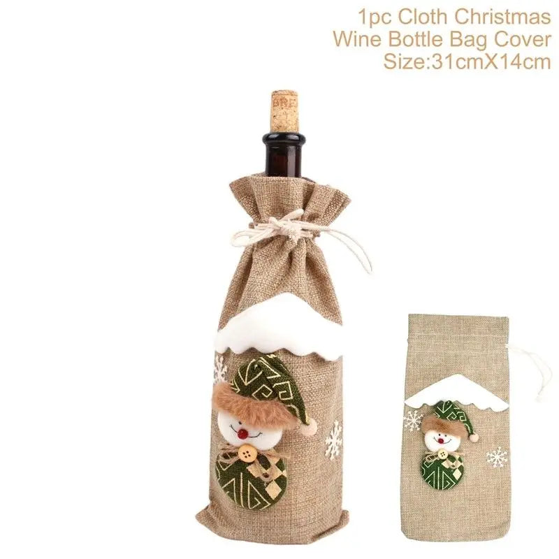 Burlap Christmas wine bottle bag cover with a snowman design and drawstring closure. Decorated with white and green accents, measuring 31cm by 14cm.
