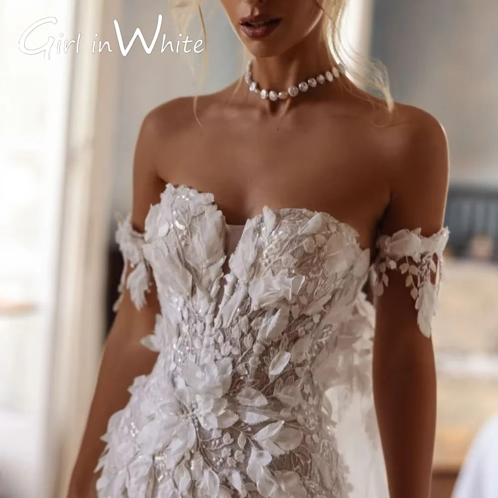 A woman in a detailed, off-shoulder white wedding gown with floral appliqué stands indoors. She wears a pearl choker necklace. Text reads "Girl in White" in the top left corner.