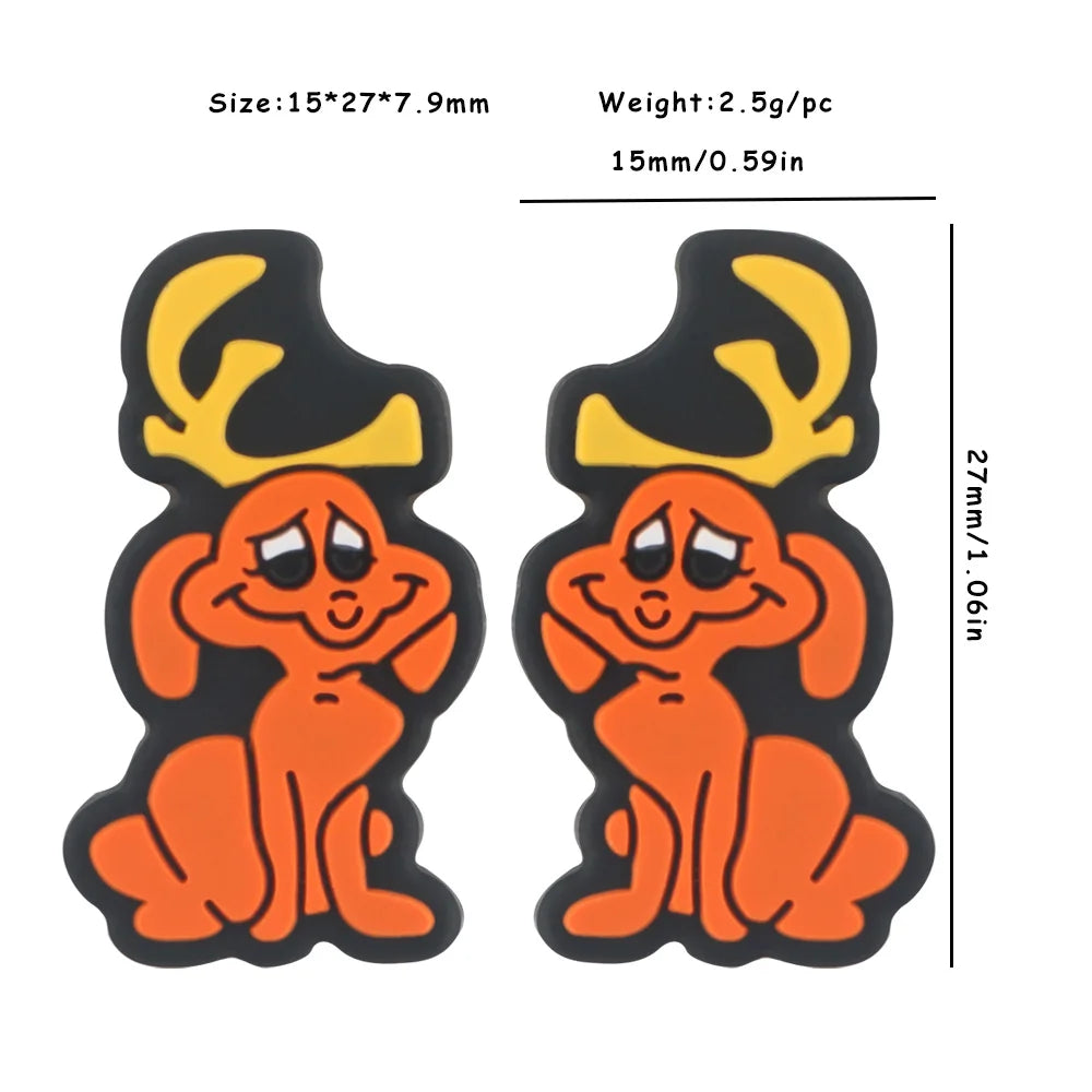 Two orange cartoon dogs with yellow antlers, sitting with a cheerful expression. Dimensions and weight are shown: 15*27*7.9mm, 2.5g each, 27mm height.