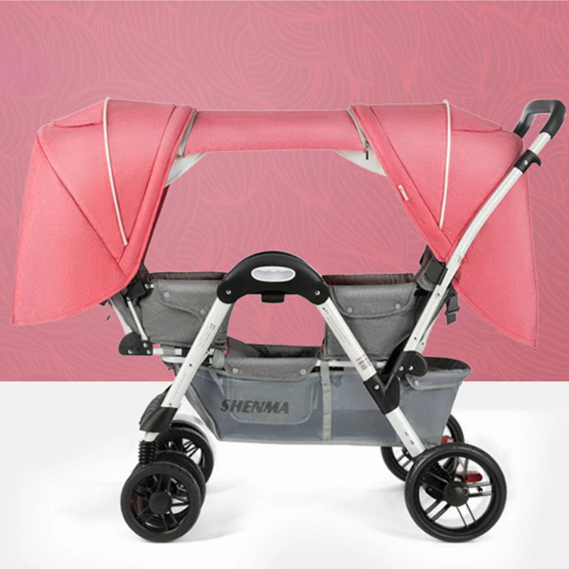 Double stroller with pink canopies and grey fabric seats, featuring a storage basket and four black wheels, set against a pink patterned background.