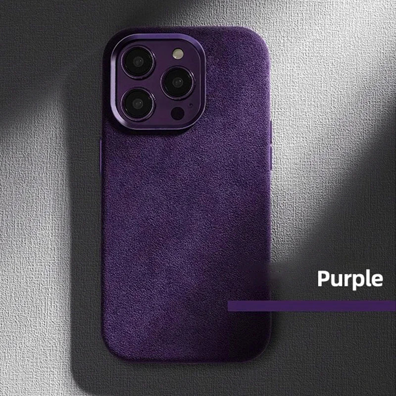 Purple suede-textured phone case on a smartphone with triple cameras, displayed on a textured gray background. Text reads "Purple" beside the case.