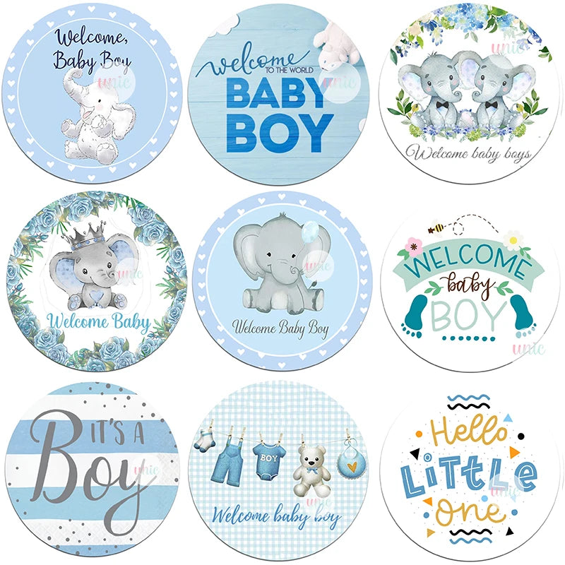 Nine circular baby boy-themed designs with blue accents. Includes elephants, clotheslines, and floral elements, featuring phrases like "Welcome Baby Boy" and "It's a Boy."