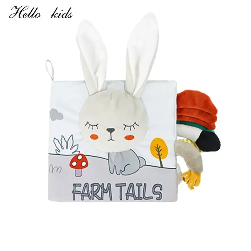 Soft children's book titled "Farm Tails" with a bunny face and long ears on the cover. Features farm-themed illustrations and a variety of fabric tail textures.