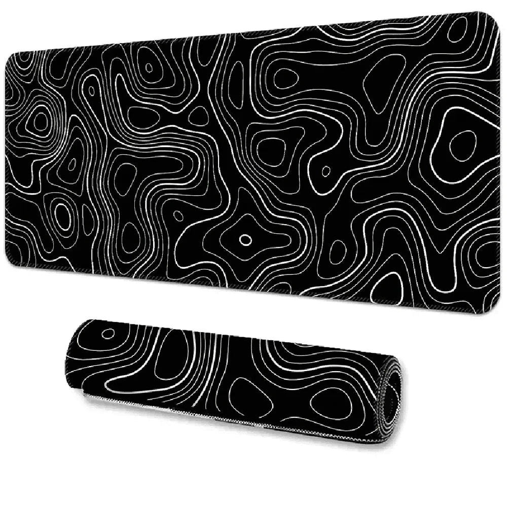 Black desk mat and matching smaller rolled mat featuring white contour lines resembling a topographic map.