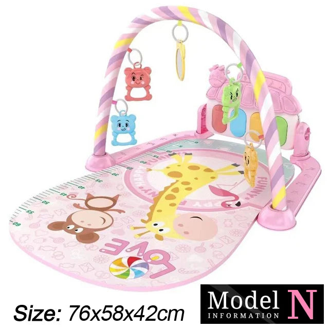 Pink baby play mat with animal prints, removable arches, and hanging rattles. Features a giraffe, monkey, and flamingo design. Dimensions: 76x58x42 cm.