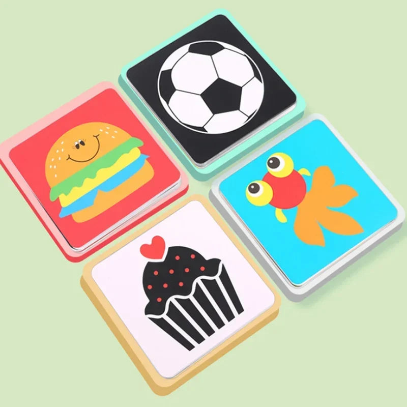 Four colorful square cards featuring a smiling burger, a soccer ball, a goldfish, and a cupcake with a heart, arranged on a light green background.