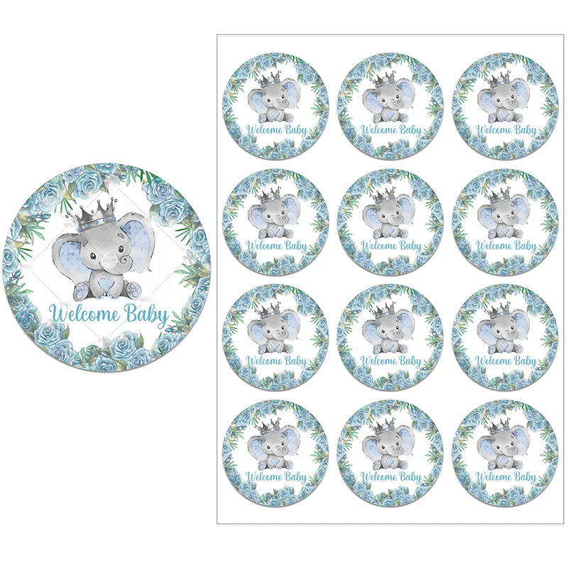 Cute elephant stickers with a crown, surrounded by blue roses and greenery, say "Welcome Baby." A sheet with multiple identical designs and a close-up of one sticker.