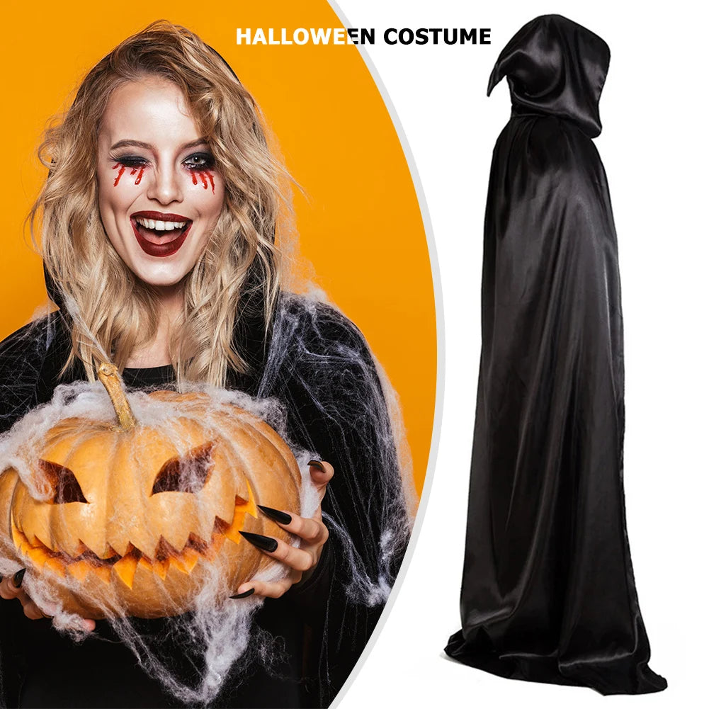 Smiling woman with dramatic makeup holding a cobweb-covered jack-o'-lantern on a bright orange background. Beside her, a black hooded Halloween costume on display.
