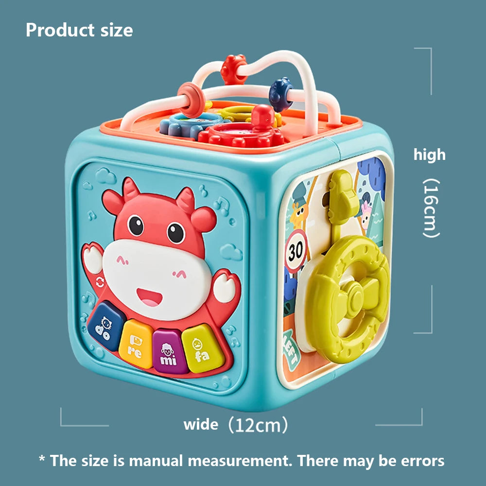 Colorful activity cube for kids, featuring an animal face, buttons with musical notes, and interactive elements. Dimensions: 16cm high, 12cm wide. Measurements may vary.