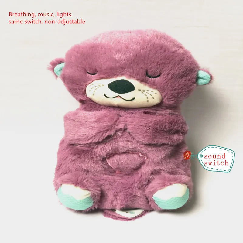 Purple plush bear toy with a smiling face, closed eyes, and a heart on its belly. It has mint green ears and feet. Text reads: "Breathing, music, lights same switch, non-adjustable."