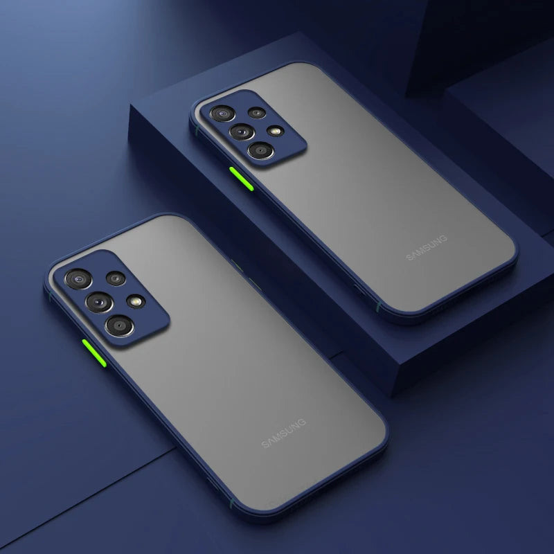 Two Samsung smartphones with sleek matte finishes and multiple rear cameras are displayed on a blue geometric surface. Bright green accents highlight the side buttons.